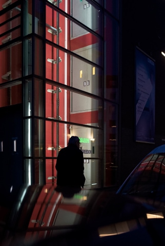 Street photograph showing everyday urban environment with spontaneous human presence and documentary-style visual approach